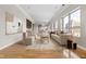 Living room with hardwood floors, large windows, and city views at 350 N Meridian St # 901, Indianapolis, IN 46204