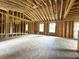 Bright living room with large windows and high ceilings at 207 N Birchwood Dr, Muncie, IN 47304
