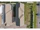 Aerial view of two-story townhouses with gray and red roofs, and a grassy backyard at 9264 Hawley Dr, Indianapolis, IN 46216