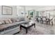 Open concept living space with sectional sofa and adjacent dining area at 9264 Hawley Dr, Indianapolis, IN 46216