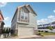 Modern townhome featuring an attached garage and stylish exterior at 9264 Hawley Dr, Indianapolis, IN 46216