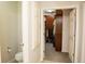 Small bathroom with toilet and access to a large walk-in closet at 5213 Dunewood Way, Avon, IN 46123