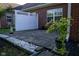 Brick paver patio with white gravel border and privacy fence at 5213 Dunewood Way, Avon, IN 46123