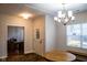 Bright dining room with hardwood floors, chandelier, and view to office at 5213 Dunewood Way, Avon, IN 46123