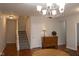 Hallway with hardwood floors, staircase, and wooden cabinet at 5213 Dunewood Way, Avon, IN 46123