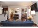 Spacious living room featuring a cozy fireplace and comfortable seating at 5213 Dunewood Way, Avon, IN 46123