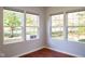 Sunroom featuring hardwood floors and wall of windows at 5213 Dunewood Way, Avon, IN 46123