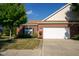 Brick ranch house with a white garage door and landscaping at 5213 Dunewood Way, Avon, IN 46123