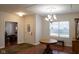 Bright dining room with hardwood floors, chandelier, and view to office at 5213 Dunewood Way, Avon, IN 46123