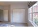Bedroom with double doors to closet and large window at 5213 Dunewood Way, Avon, IN 46123