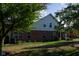 Brick home with beige accents and mature trees at 5213 Dunewood Way, Avon, IN 46123