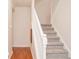 Elegant staircase with a classic white railing and carpeted steps at 5213 Dunewood Way, Avon, IN 46123