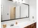 Bathroom with large mirror and wood vanity at 5213 Dunewood Way, Avon, IN 46123