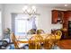 Dining area features hardwood floors and access to backyard at 5213 Dunewood Way, Avon, IN 46123