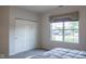 Bedroom with double doors to closet and large window at 5213 Dunewood Way, Avon, IN 46123