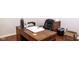 Home office with a wooden desk, chair and hardwood floors at 5213 Dunewood Way, Avon, IN 46123