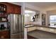 Kitchen boasts stainless steel refrigerator and ample cabinetry at 5213 Dunewood Way, Avon, IN 46123