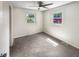 Bright bedroom with neutral carpeting and ample natural light at 4013 N Graham Ave, Indianapolis, IN 46226