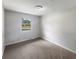 Bright bedroom with neutral walls and carpet at 4013 N Graham Ave, Indianapolis, IN 46226