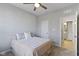 Charming bedroom with ceiling fan and access to a full bath at 17084 Cole Evans Dr, Noblesville, IN 46060