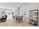 Casual dining area with a round table and four chairs near the kitchen and living room at 17084 Cole Evans Dr, Noblesville, IN 46060