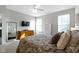 Bright main bedroom with a dresser and large windows at 17084 Cole Evans Dr, Noblesville, IN 46060
