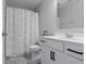 Bathroom with shower/tub combo, vanity, and patterned curtain at 17084 Cole Evans Dr, Noblesville, IN 46060