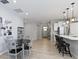 Bright dining area features a round table with four chairs, located near the kitchen at 17084 Cole Evans Dr, Noblesville, IN 46060