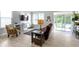 Relaxing living room features a brown sectional sofa, a comfy armchair, and sliding glass doors at 17084 Cole Evans Dr, Noblesville, IN 46060