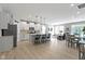 Modern kitchen features white cabinets, stainless steel appliances, and an island with seating at 17084 Cole Evans Dr, Noblesville, IN 46060