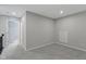 Spacious loft area with gray walls and carpet at 17084 Cole Evans Dr, Noblesville, IN 46060