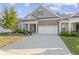 Gray and brick two-story home with white garage door at 17084 Cole Evans Dr, Noblesville, IN 46060