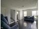Spacious living room featuring dark hardwood floors and a fireplace at 6091 Michigan Rd, Indianapolis, IN 46228