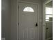 Front entry with a white door and security system at 6091 Michigan Rd, Indianapolis, IN 46228