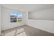 Bright bedroom with carpet, large window, and neighborhood view at 4168 Dutton Dr, Bargersville, IN 46106