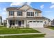 Two-story house with neutral siding, stone accents, and a large front yard at 4168 Dutton Dr, Bargersville, IN 46106