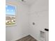 Bright laundry room featuring built-in shelving and vinyl flooring at 4168 Dutton Dr, Bargersville, IN 46106