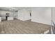 Open concept living area with hardwood floors and kitchen access at 4168 Dutton Dr, Bargersville, IN 46106