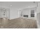 Spacious living room with hardwood floors and a modern fireplace at 4168 Dutton Dr, Bargersville, IN 46106