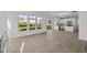 Open concept living room and kitchen with hardwood floors and access to backyard at 4168 Dutton Dr, Bargersville, IN 46106