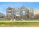 Three-story townhouses with modern finishes and attached garages at 7284 County Road 600 W, McCordsville, IN 46055