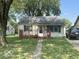 Tan house with front porch and yard at 728 Lonsvale Dr, Anderson, IN 46013