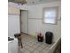 Kitchen with beige cabinets, linoleum floor, and exterior door at 3033 Forest Manor Ave, Indianapolis, IN 46218