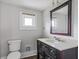 Bathroom with vanity, mirror, and updated fixtures at 3403 N College Ave, Indianapolis, IN 46205