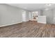 Upstairs hallway with doors to bedrooms and bathroom, featuring hardwood floors at 7244 Birch Leaf Dr, Indianapolis, IN 46259