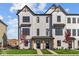 Modern farmhouse style house with white siding, black accents, and landscaping at 4190 Douro Trl, Westfield, IN 46062