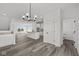 Spacious dining area with hardwood floors and a view into the kitchen and living room at 4190 Douro Trl, Westfield, IN 46062