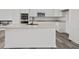 Modern kitchen with white cabinets, quartz countertops, and stainless steel appliances at 4190 Douro Trl, Westfield, IN 46062