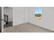 Well-lit bedroom featuring a window and access to the staircase at 4190 Douro Trl, Westfield, IN 46062