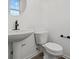 Simple bathroom with pedestal sink, toilet, and dark fixtures at 4190 Douro Trl, Westfield, IN 46062